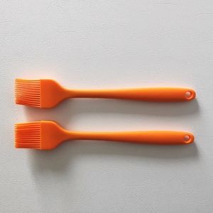 NWOT Silicone brush in orange color one pair